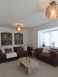 Living room progress so far…

Since moving in at the end of January, here’s where we’re at with the living room so far🌿

We went for the Ada sofa from dfs in the chocolate and stone combo and I’m honestly obsessed with how cosy it’s made the space feel already.

Luckily we found a cuddler chair that fits so perfectly in the bay window 🙌🏼

Now ChatGPT has confused me on whether I should go for shelves above the sofa or keep pictures there?!

Still a work in progress but it’s slowly coming together.
Swipe for the AI inspo… unless I change my mind by then 🙃