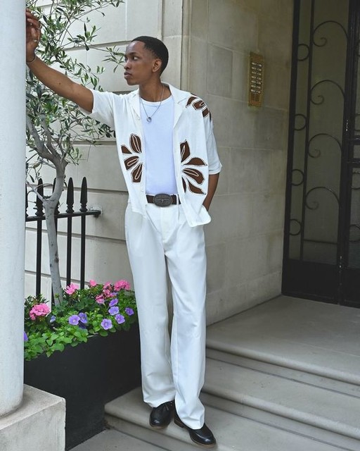 ASOS DESIGN relaxed knitted button through polo with floral embroidery in ecru
